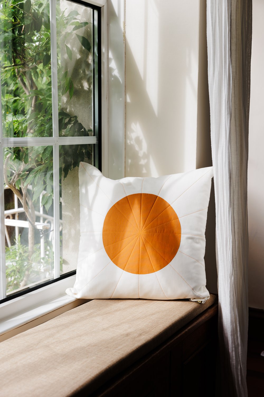 Sunburst quilt cushion by Excell Quilt Co.